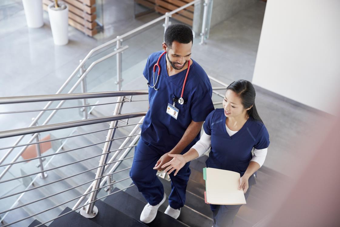 Two doctors walking stairs