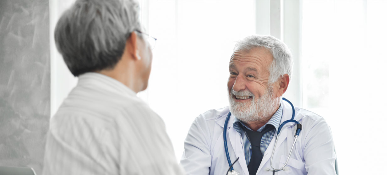 Doctor laughing with patient